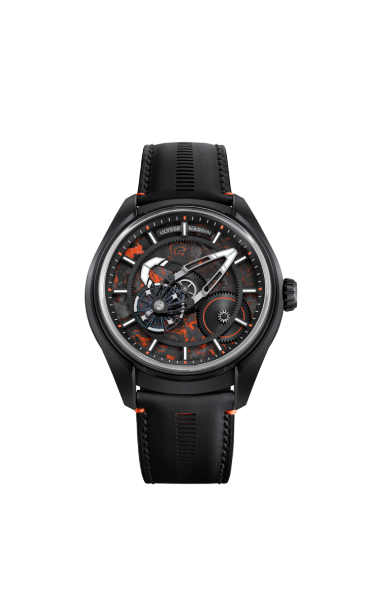 A Ulysse Nardin wristwatch with a black ceramic case, black strap, and a complex skeleton dial featuring orange and gray mechanical details.