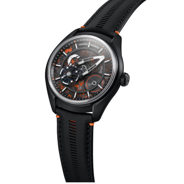 A black dialux watch with a black leather strap, featuring an open-heart design with orange accents and a black dial with silver and white details, shown on a white background.