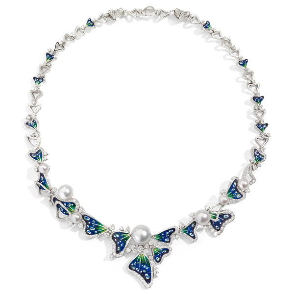 Necklace with butterfly designs and pearls on a white background
