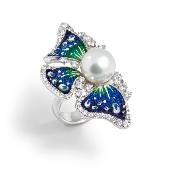 Butterfly-shaped ring with a pearl center on a white background