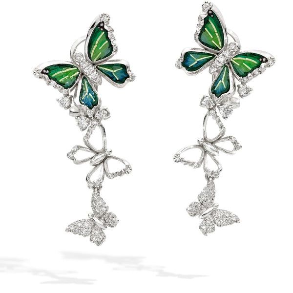 Butterfly-shaped earrings with green wings and silver accents on a white background