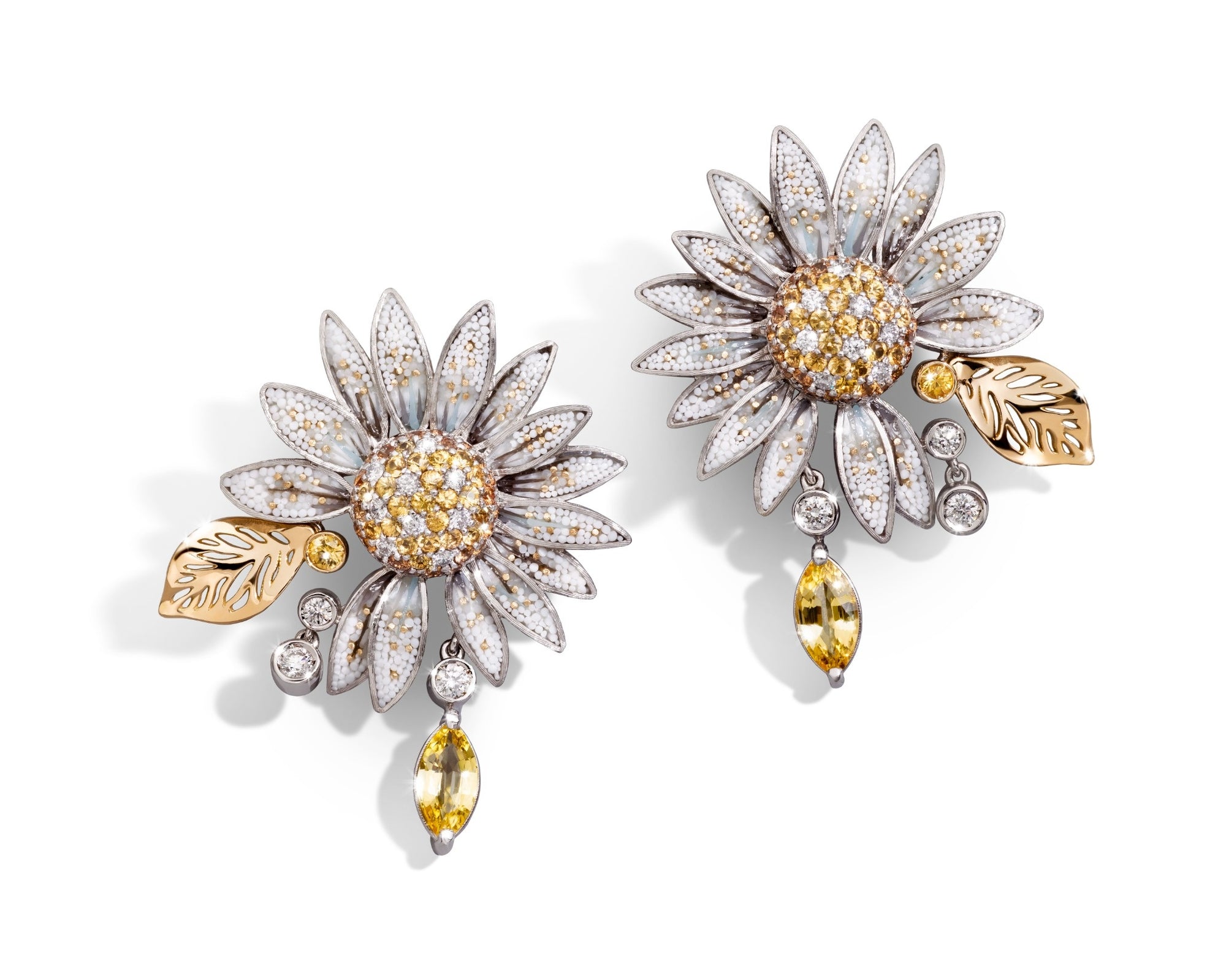 Floral-themed earrings with gold and silver details on a white background