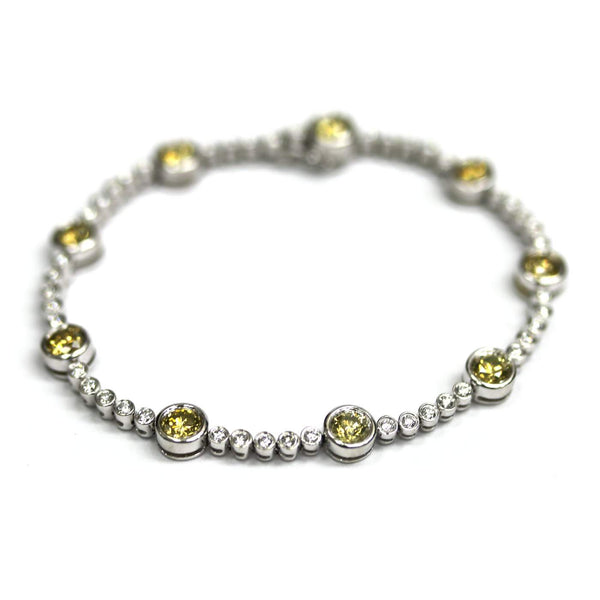 18K White Gold ~5.00ctw Bezel Set Diamond Bracelet  And 9 Irradiated Yellow Diamonds.
