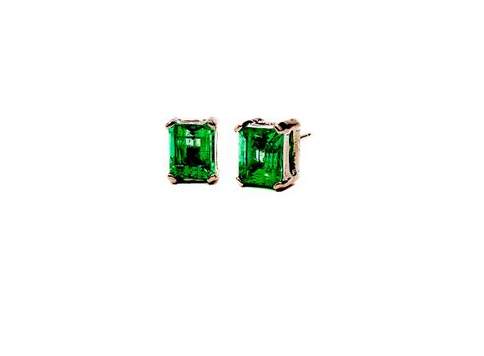 14K White Gold ~1.50ctw Emerald Studs.  Set In 4 prong Baskets With Friction Posts.