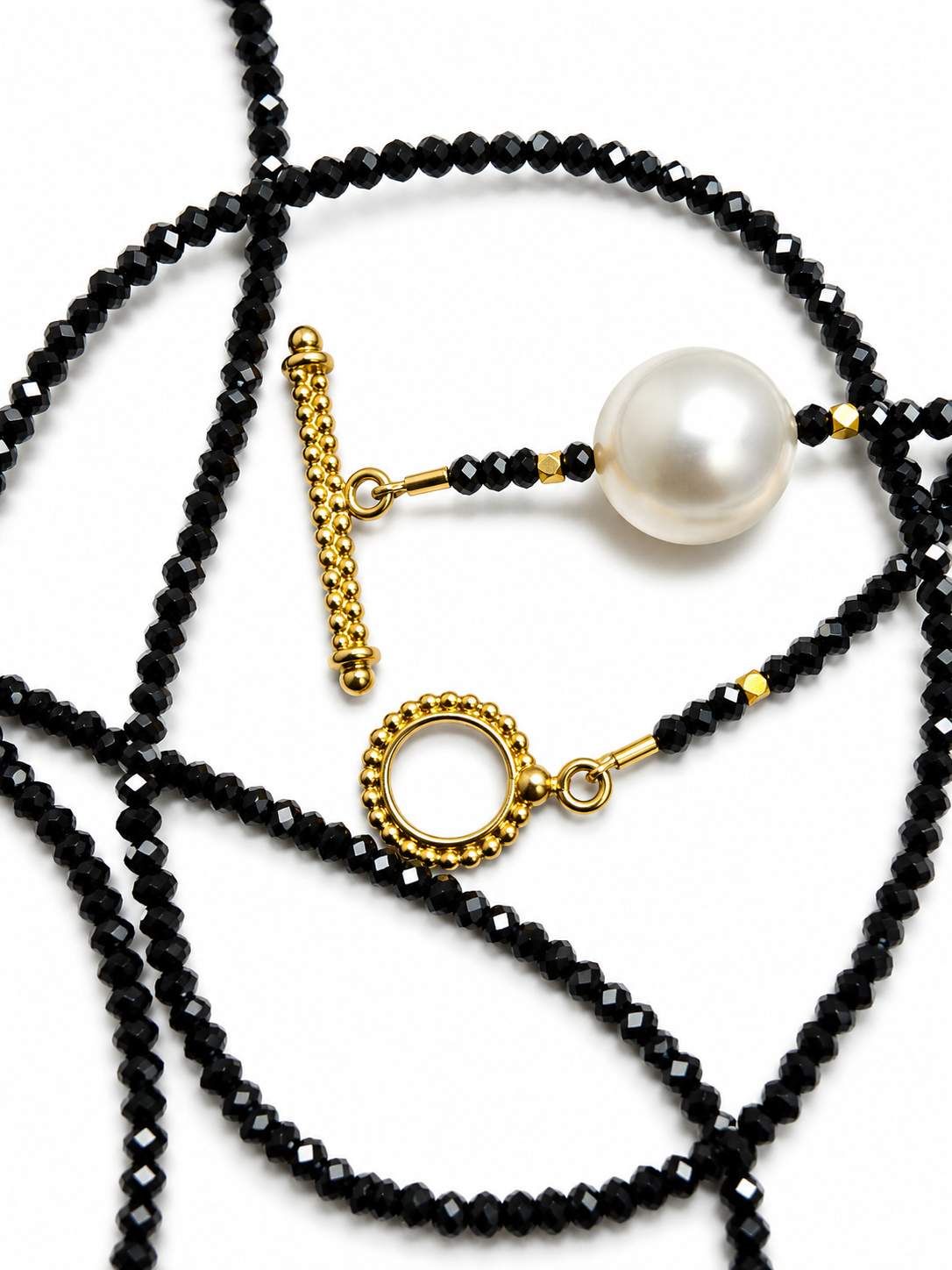 18K Onyx Briolette on faceted mini onyx bead 36" necklace with 18k Toggle Clasp.