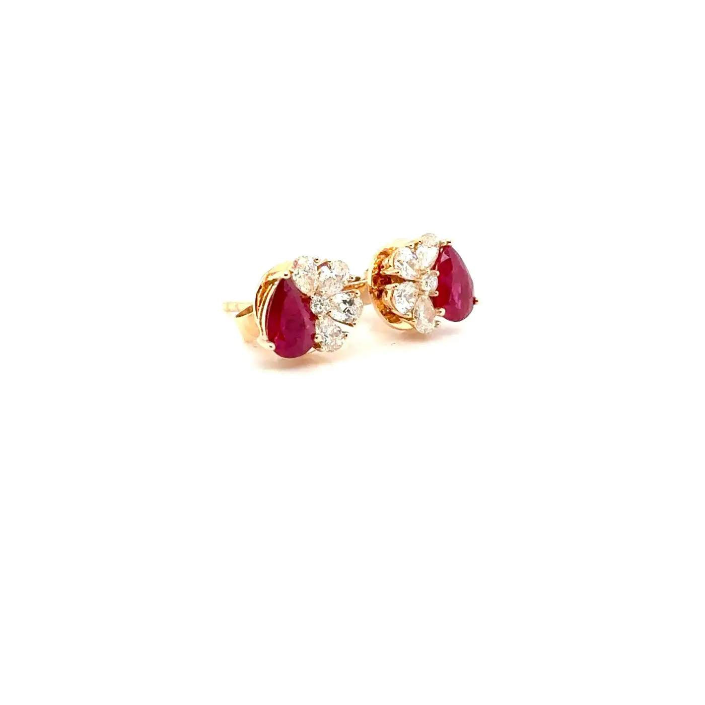 18K Pear Cut Ruby And Diamond Stud Earrings