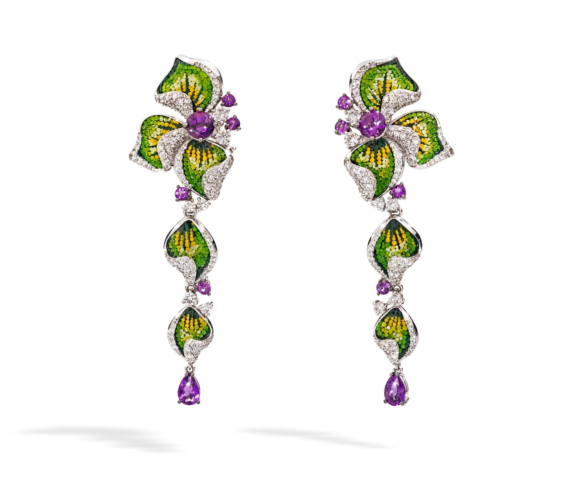 Pair of floral earrings with green, purple, and yellow accents on a white background