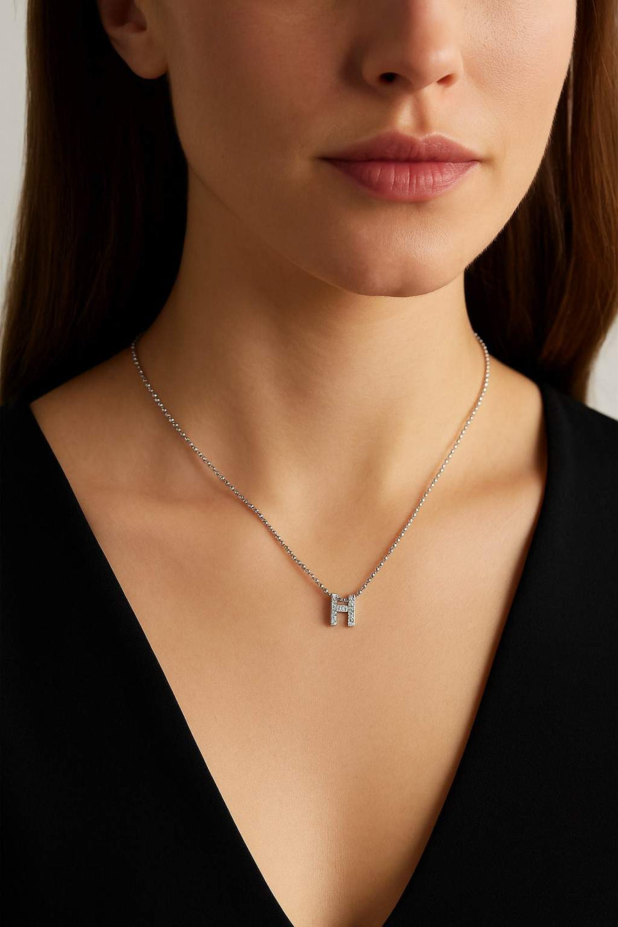 18KT GOLD ROBERTO COIN LOVE LETTER "H" NECKLACE.