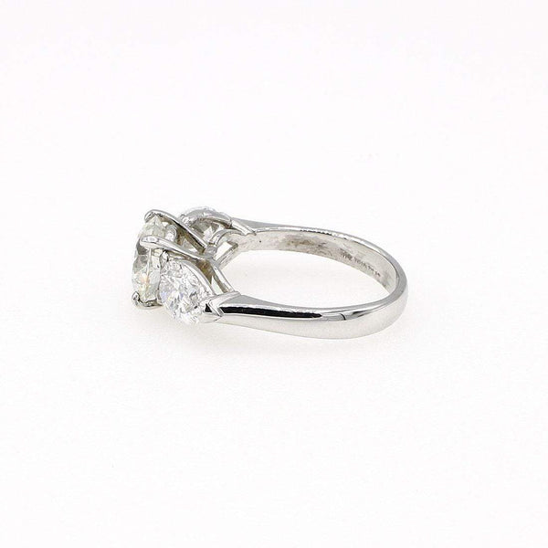 ROUND AND PEAR DIAMOND ENGAGEMENT RING