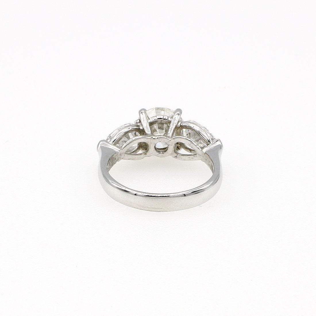 ROUND AND PEAR DIAMOND ENGAGEMENT RING