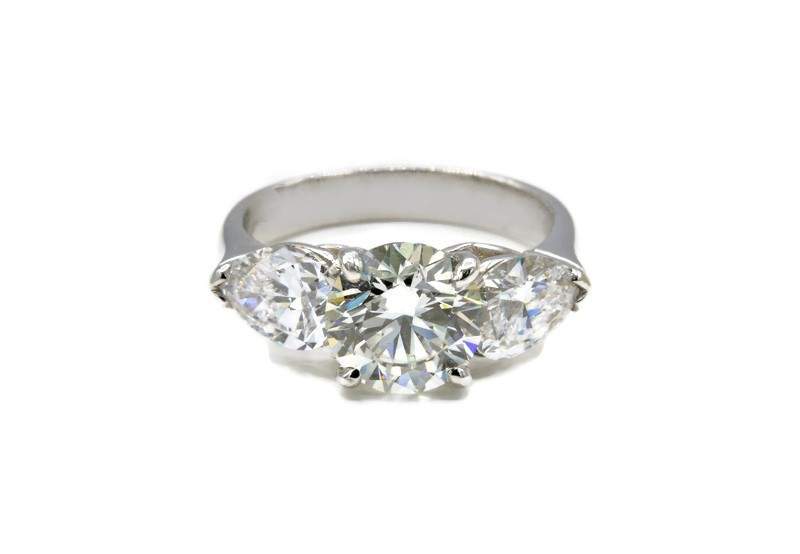 ROUND AND PEAR DIAMOND ENGAGEMENT RING