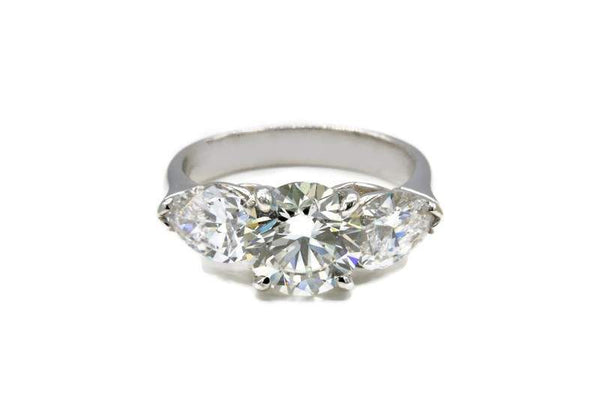 ROUND AND PEAR DIAMOND ENGAGEMENT RING
