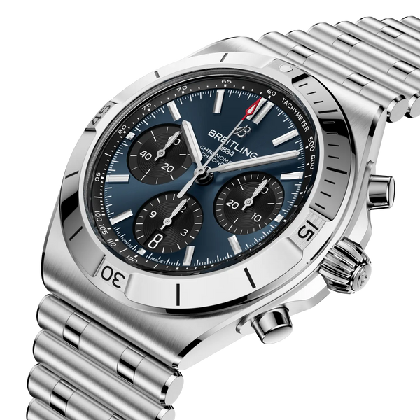 Steel Breitling watch with a blue dial on a white background