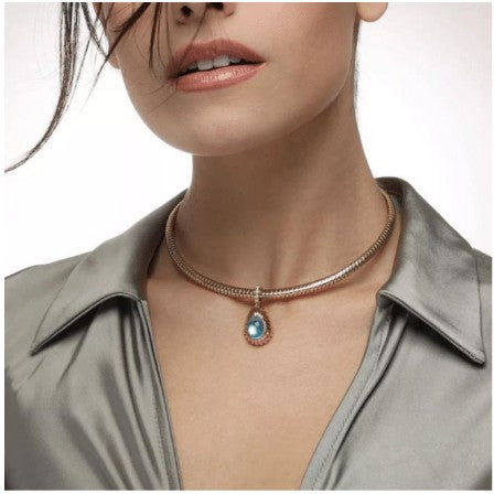 Woman with brunette hair modeling a necklace