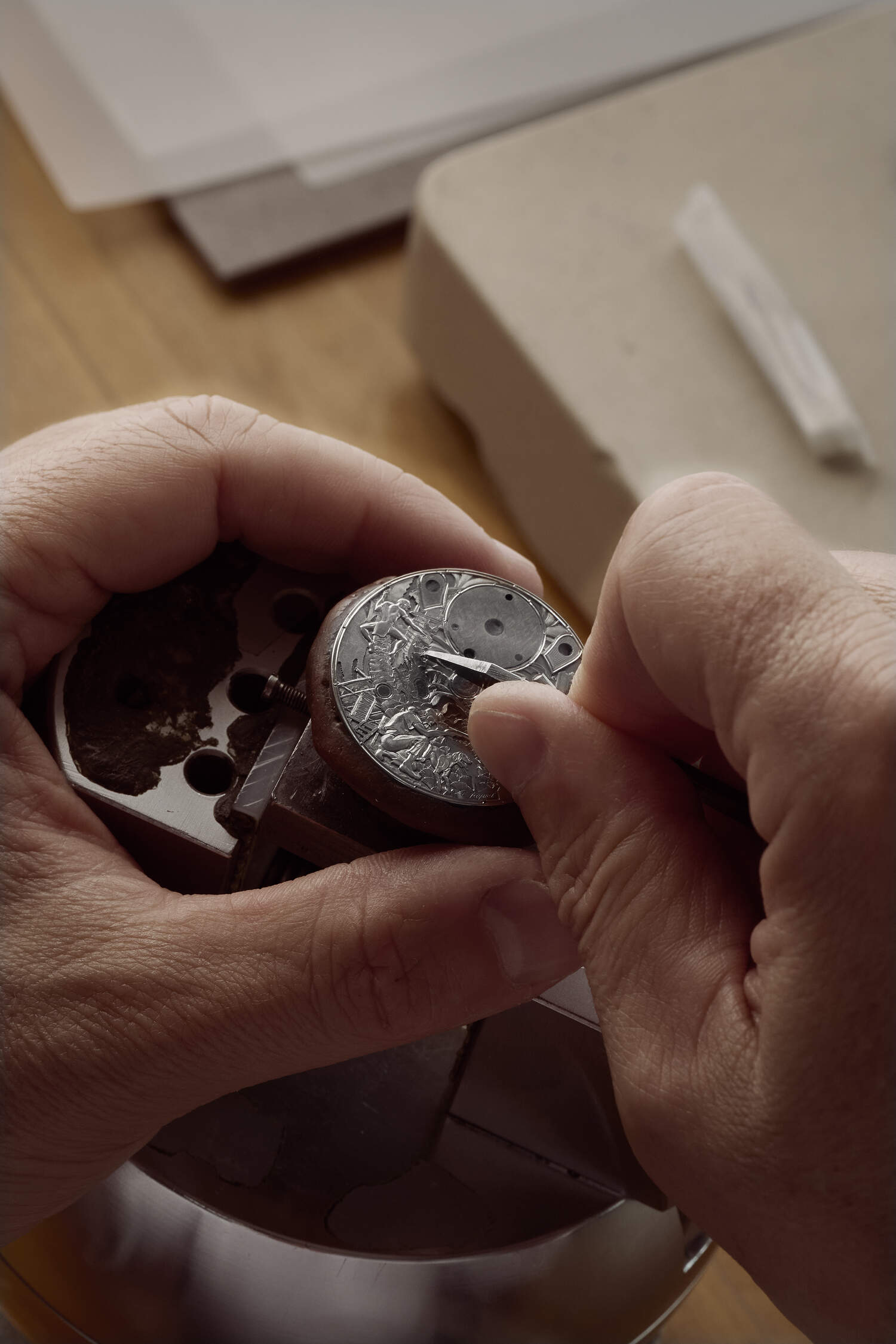 Master Engraver, Eddy Jacquet hands shown in photo working on engravings on MB&F watch.