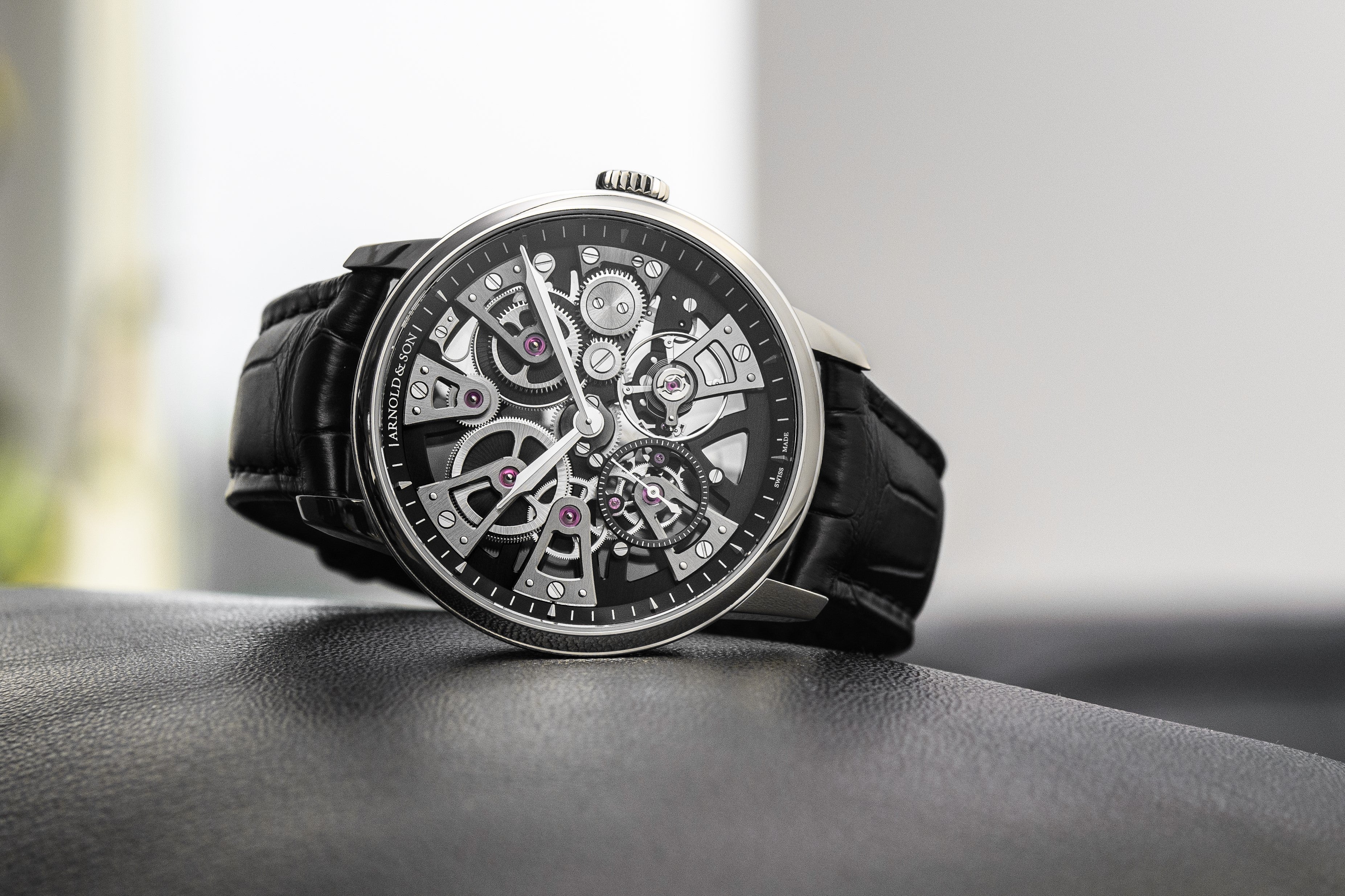 Lifestyle Image- The Stellar Nebula 40 Steel Watch by Arnold and Son displayed in table