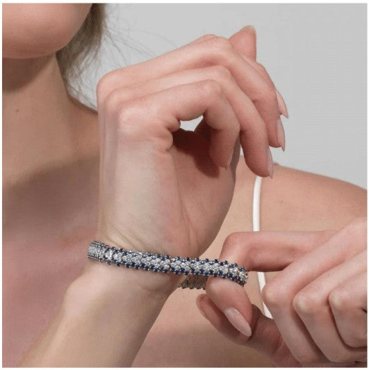 Lifestyle Image- Luxury stretch bracelet displayed on woman's wrist. Jewelry is from David Weisz's Stretch Collection
