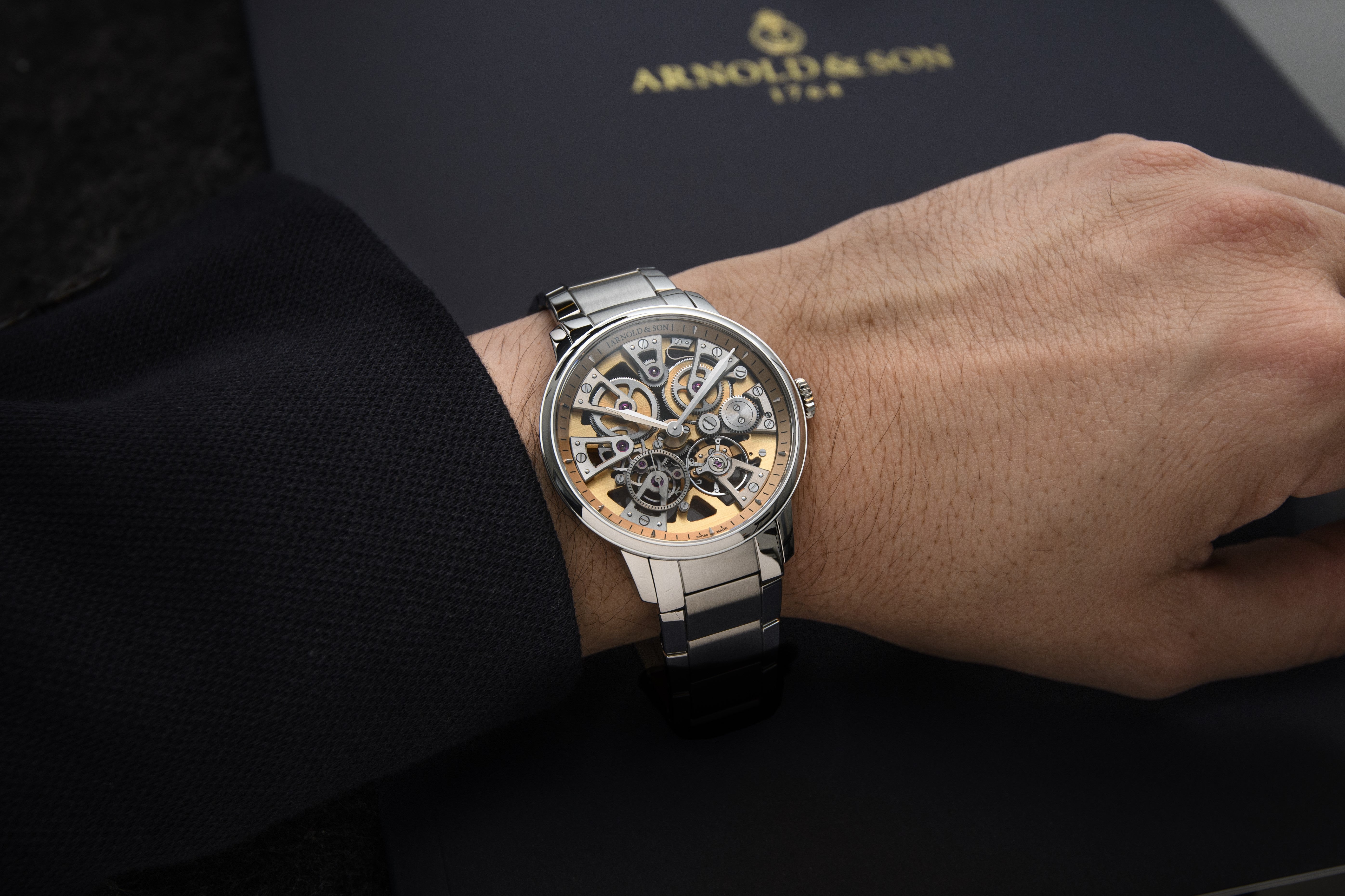 Lifestyle Image- Man wearing The Stellar Nebula 40 Steel Watch by Arnold and Son on his wrist