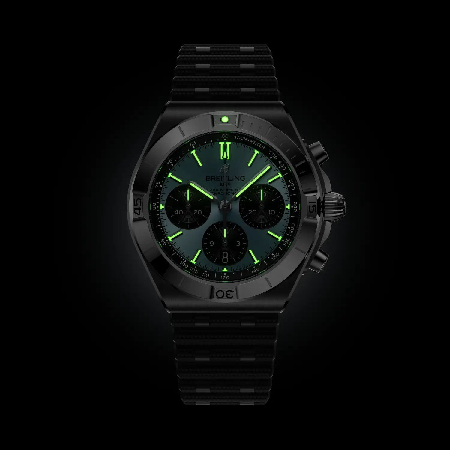 Breitling watch with green digital display on a black background