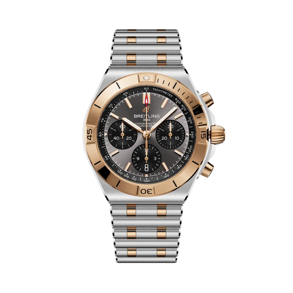 Luxury watch with silver and rose gold band on a white background