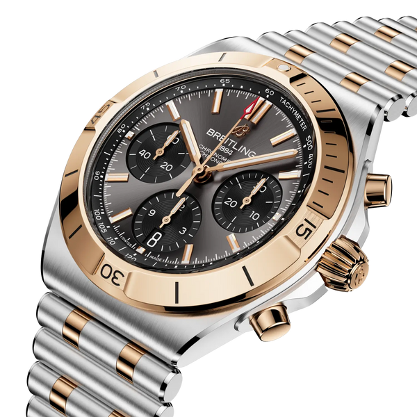 Luxury Breitling watch with silver and rose gold accents on a white background